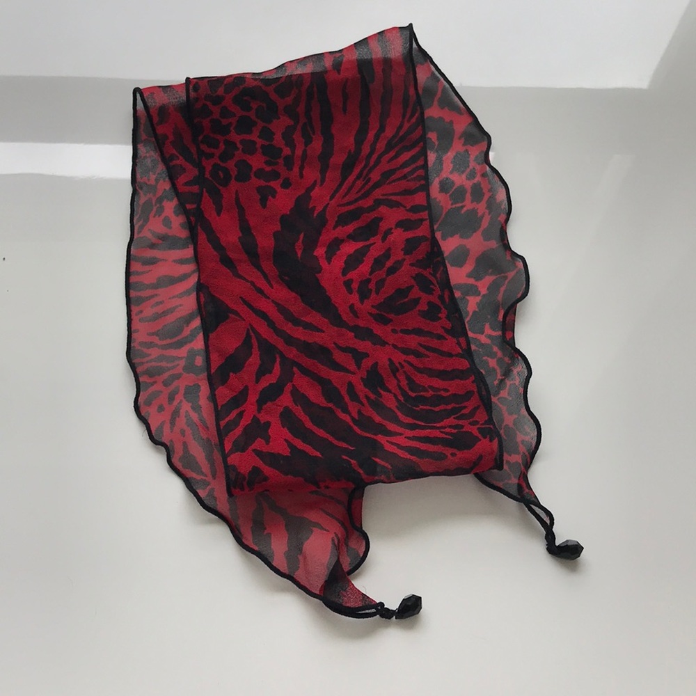 Red and black silk animal print scarf.